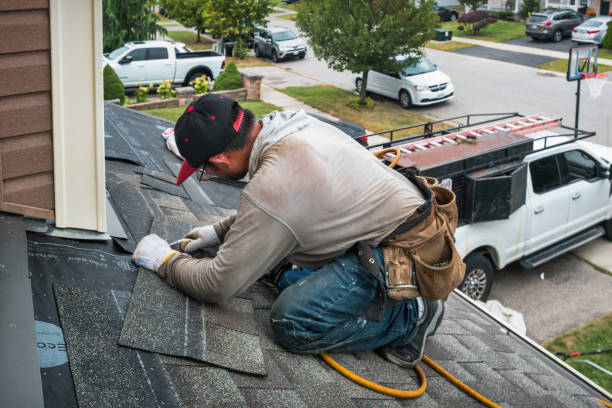 Professional Storm Damage Roof Repair technician working in Bedford, PA